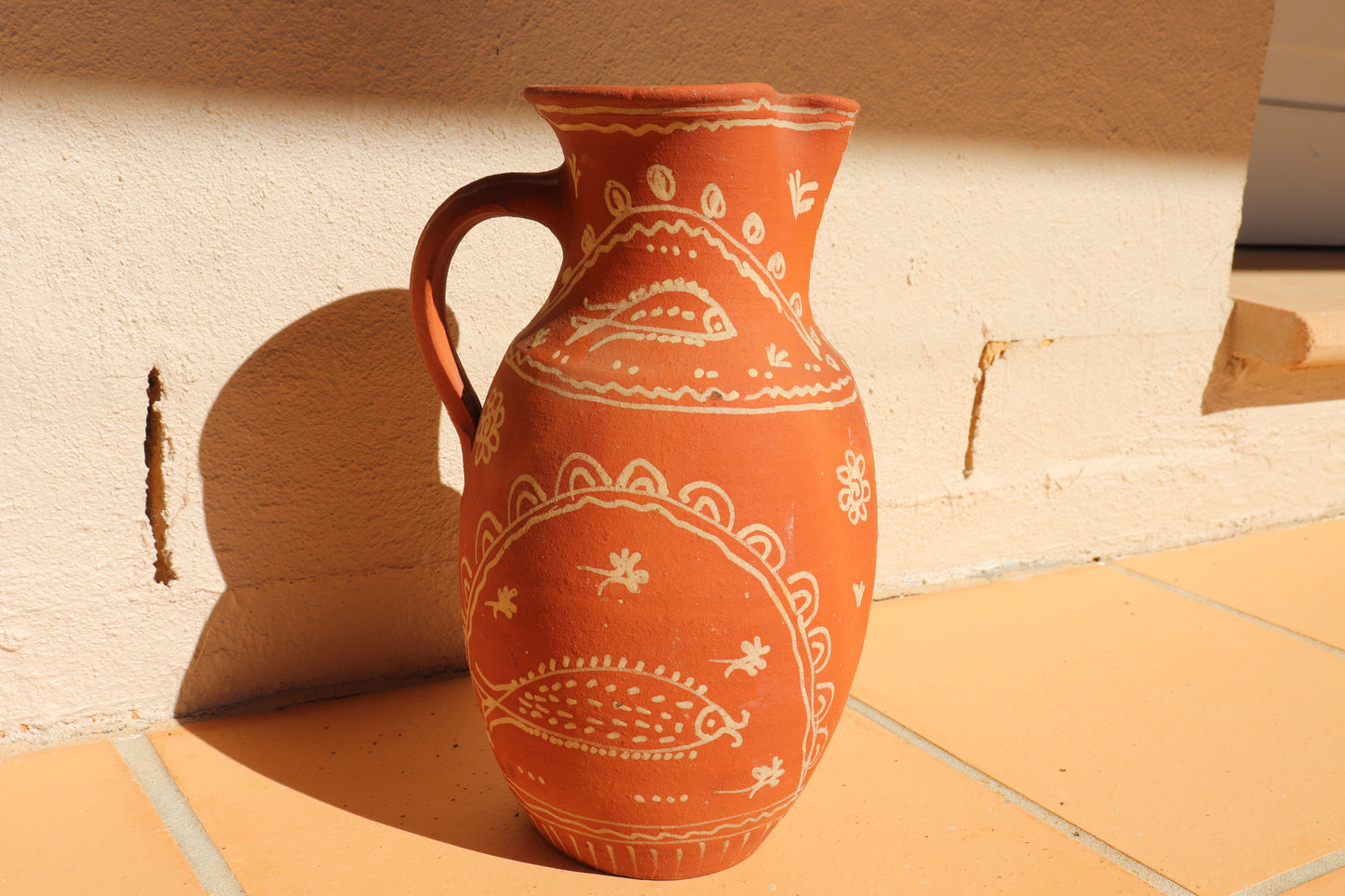 HAND PAINTED TERRACOTTA JUG
