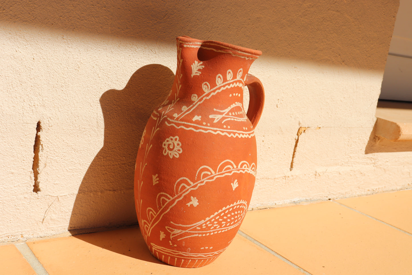 HAND PAINTED TERRACOTTA JUG