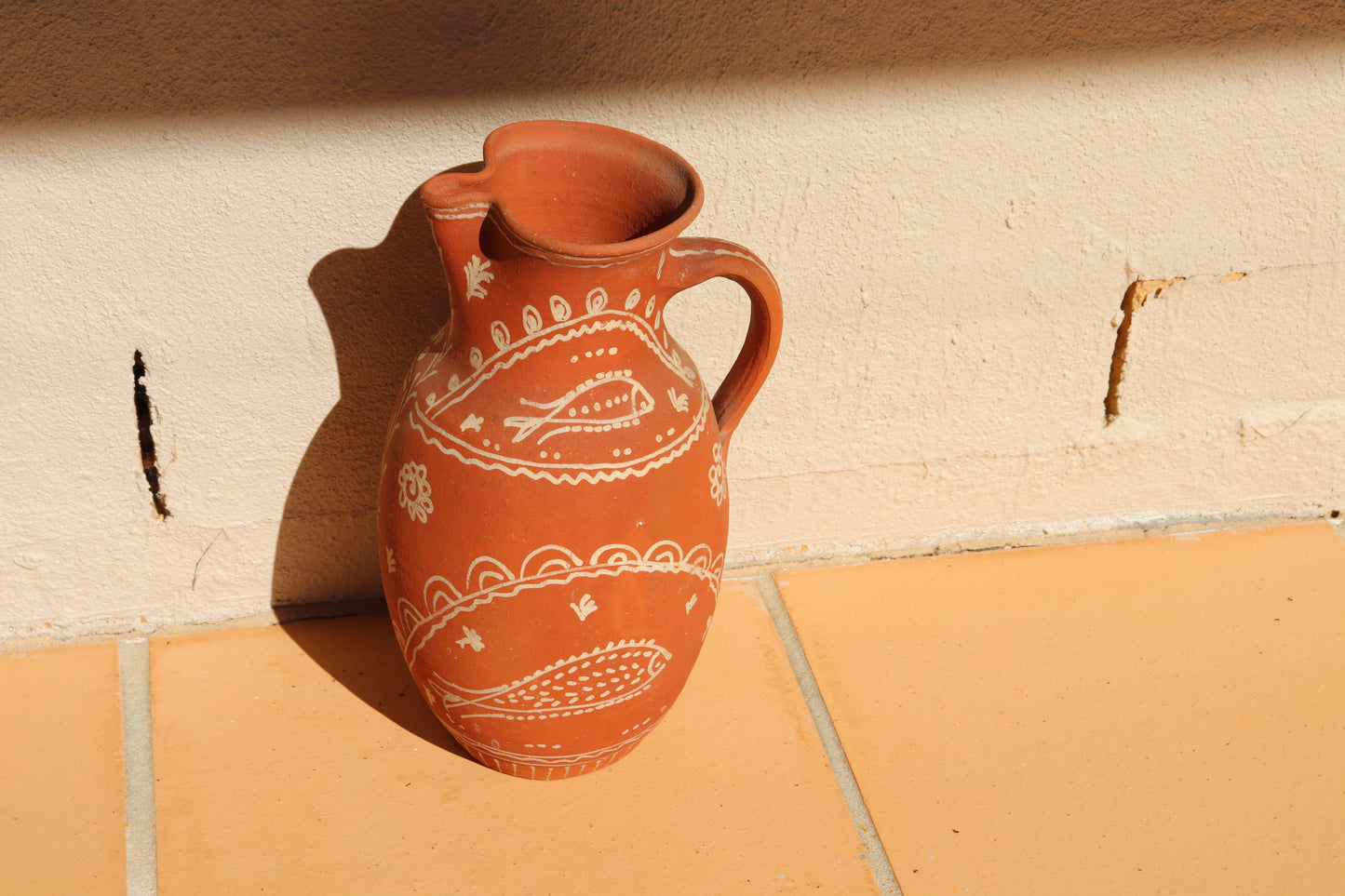 HAND PAINTED TERRACOTTA JUG