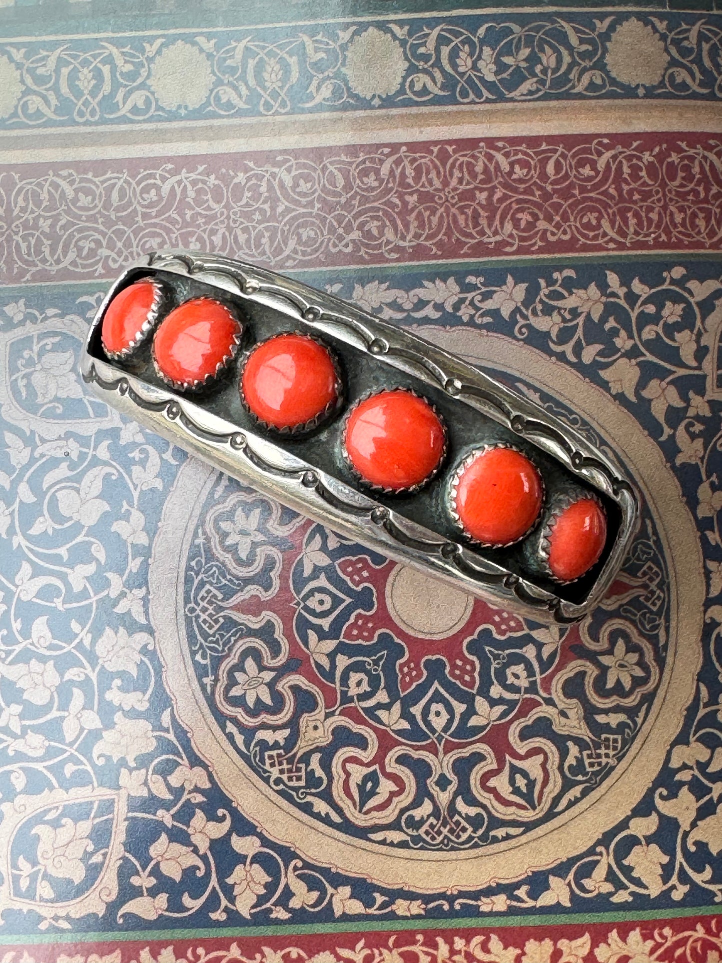 STERLING SILVER AND CORAL NAVAJO CUFF